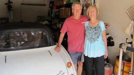 Mr and Mrs Russell with their Austin Healey in their Texas garage.