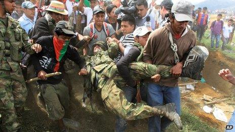 Nasa Indians drag a soldier down Berlin mountain in Cauca province