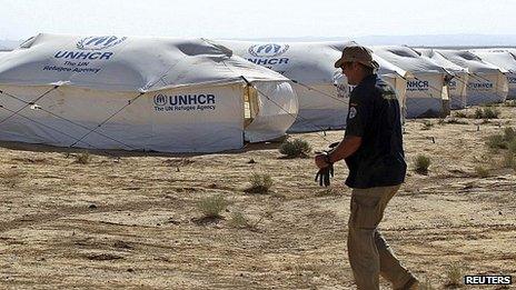 Aid worker at Zaatri refugee camp near Mafraq on the Jordanian-Syrian border. 21 July 2012