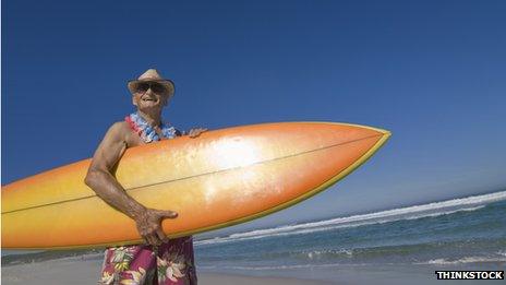 Elderly man with surfboard