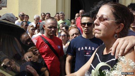 Ofelia Acevedo, wife of Cuban activist Oswaldo Paya, mourns at a procession for his burial in Havana