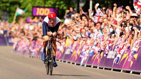 Bradley Wiggins races towards the finish line at Hampton Court Palace in the cycling time trial