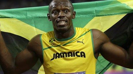 Usain Bolt celebrates his 100m victory