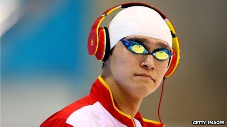 Sun Yang wearing headphones