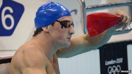 Michael Jamieson removes a swimming cap