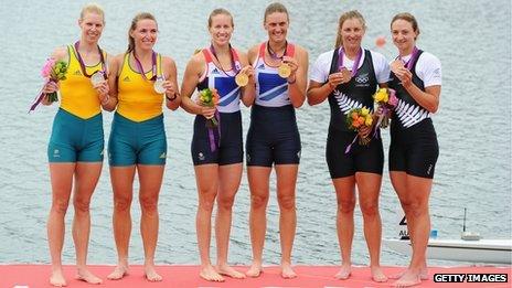 Rowers displaying their medals
