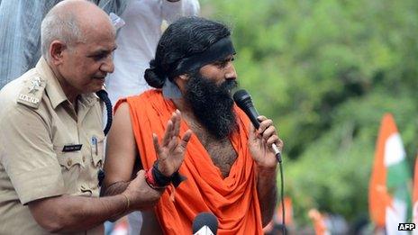 Indian yoga guru Baba Ramdev addresses the media and his supporters after his arrest in New Delhi on August 13, 2012