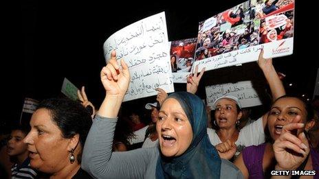 Tunisian women shout slogans during a protest calling for the respect of women's rights (13 August 2012)