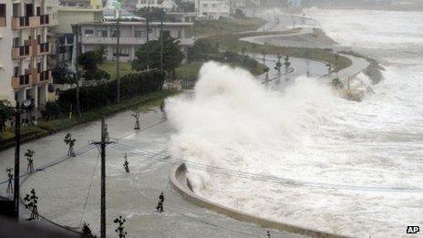 High waves lash the sea wall in Yonabarucho, Okinawa prefecture (26 August)