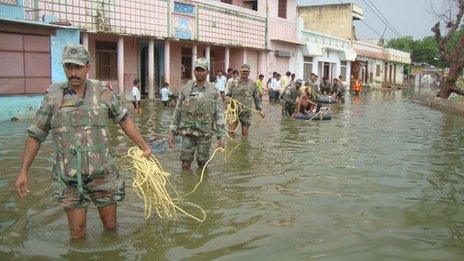 Indian Soldiers help in rescue operations in a flooded Sikar district of Rajasthan