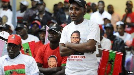 Unita supporters listen to a speech by their leader Isaias Samakuva on 29 August 2012 in Luanda during the final rally before elections on Friday