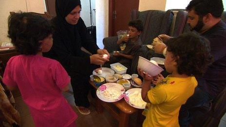 Qadour family eating