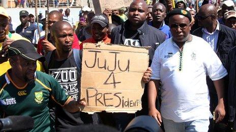 The former leader of the South African ruling party"s youth league, Julius Malema (C), arrives on September 11, 2012 at the Gold Fields Driefontein mine in Carletonville,