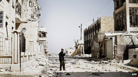 Syrian rebel fighter in ruined Aleppo