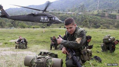 Colombian police land during clashes with Farc rebels
