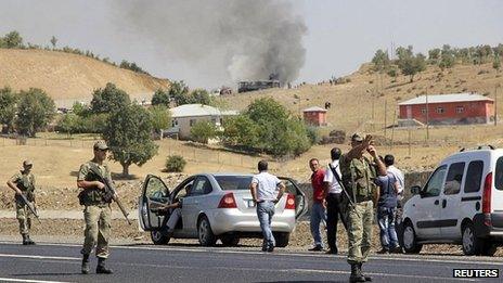 Turkish soldiers seal off an area after a bus is attacked by the armed PKK rebel group
