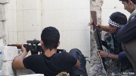 Syrian rebels crouch in Aleppo, 18 September