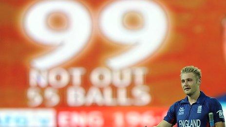 England's Luke Wright next to a sign showing his 99 not out