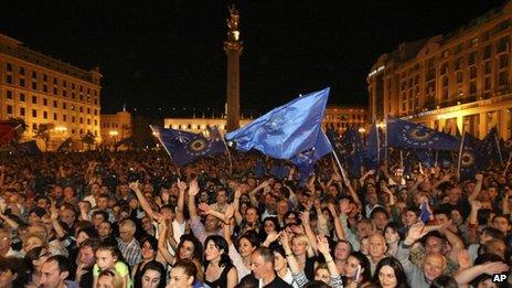 Opposition supporters celebrate in the central square during a rally in Tbilisi Georgia
