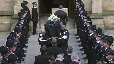Police officers formed a guard of honour at Manchester Cathedral