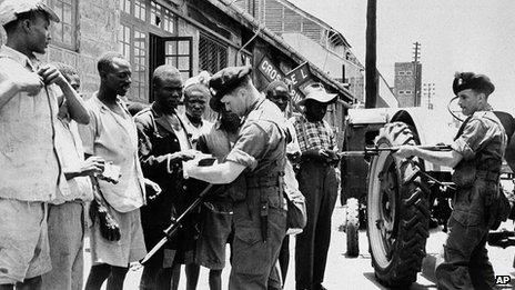 British soldiers quizzing Kenyan men