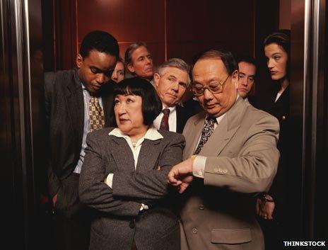 Eight people squeezed in a lift