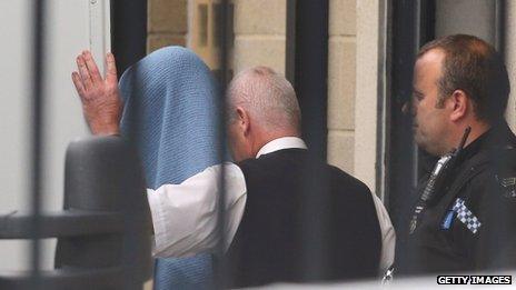 Mark Bridger is led into court in Aberystwyth under a blanket