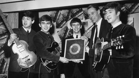 The Beatles with a silver disc in 1963