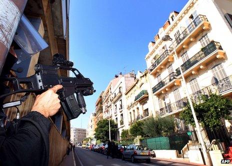 A French policeman stands guard in Cannes during an anti-terrorist operation, 6 October