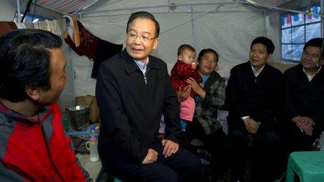 Wen Jiabao talks to villagers after a deadly landslide in Yunnan, 2012