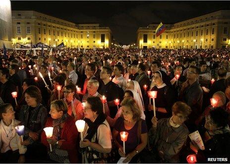 Catholics attend a candlelight procession to mark the 50th anniversary of Vatican II at the Vatican, 11 October