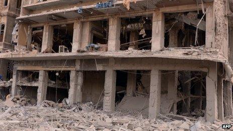 Syrian's state news agency (SANA) issued this photo of this building torn apart by a bombing in a government-controlled district of Syria's commercial capital, Aleppo