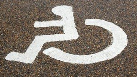 A disabled sign on a road