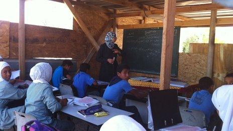 Bedouin children are taught at Khan al-Ahmar school