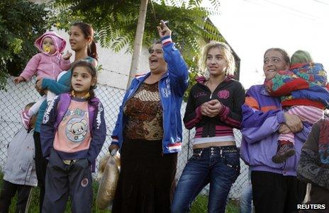 Women cheer a Roma (Gypsy) rally in Miskolc, 17 October