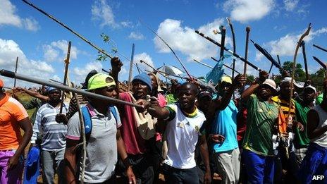 Thousands of striking miners march to the offices of Anglogold Ashanti in Carletonville on October 18, 2012.