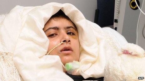 Malala Yousafzai lying in her bed after receiving treatment at the Queen Elizabeth Hospital/University Hospitals in Birmingham