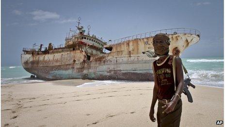 A Somali pirate poses in front of a Taiwanese fishing vessel - photo 23 September