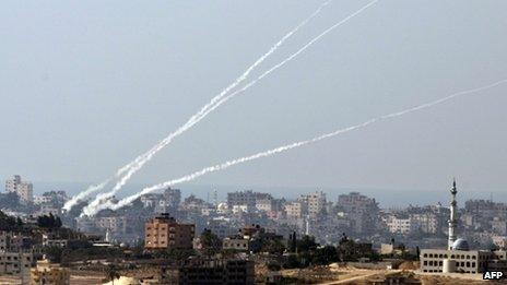 A trail of smoke is seen as a rocket is launched from the Palestinian Gaza Strip towards southern Israel