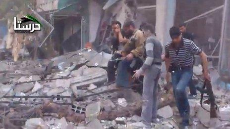Video posted online by opposition activists purportedly showing rebel fighters searching for survivors after an air strike in Harasta, Damascus (29 October 2012)