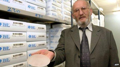 President of PIP Jean-Claude Mas holding a breast implant, January 2001