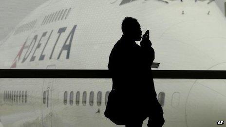 A passenger waiting for a Delta Airlines flight in Detroit.