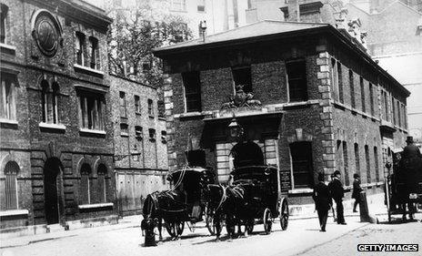 Scotland Yard, left, next to Public Carriage Office in 1875