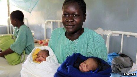 Millicent Owuor carries her twins (7 November)