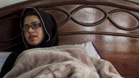 Pakistani schoolgirl Kainat Riaz recuperating in bed after the Taliban attack on her school bus