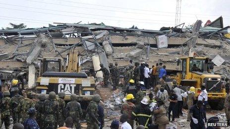 Rescuers at the collapsed building in Accra on 7 November.