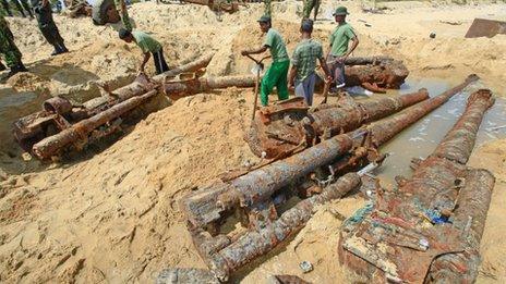 Sri Lankan army soldiers dig out heavy weapons, which they said were buried by the Liberation Tigers of Tamil Eelam (LTTE) at the end of the three-decade war against Sri Lanka troops in 2009
