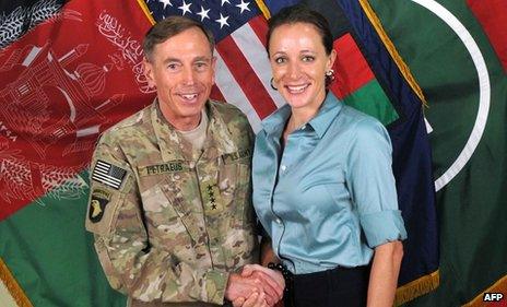 This July 13, 2011 handout image provide by Nato, shows then Commander General David Petraeus shaking hands with his biographer Paula Broadwell in Afghanistan
