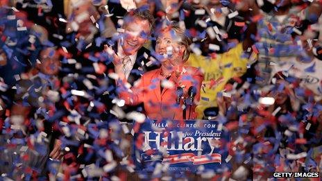 Clinton and campaign chairman Terry McAuliffe are covered in a wave of confetti during a primary night rally at the Charleston Civic Center, West Virginia, in May 2008.