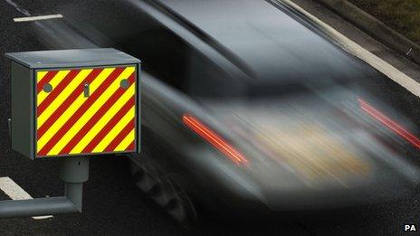 A driver passes a speed camera